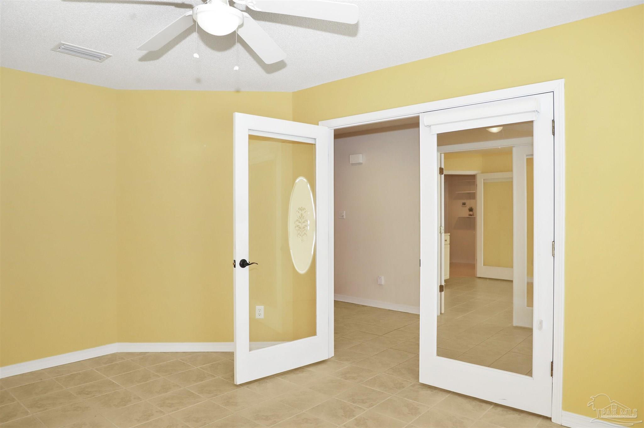 4454 Lyons Place Holt, FL 32564 - Photo 17 of 53 a view of a bathroom with a glass door