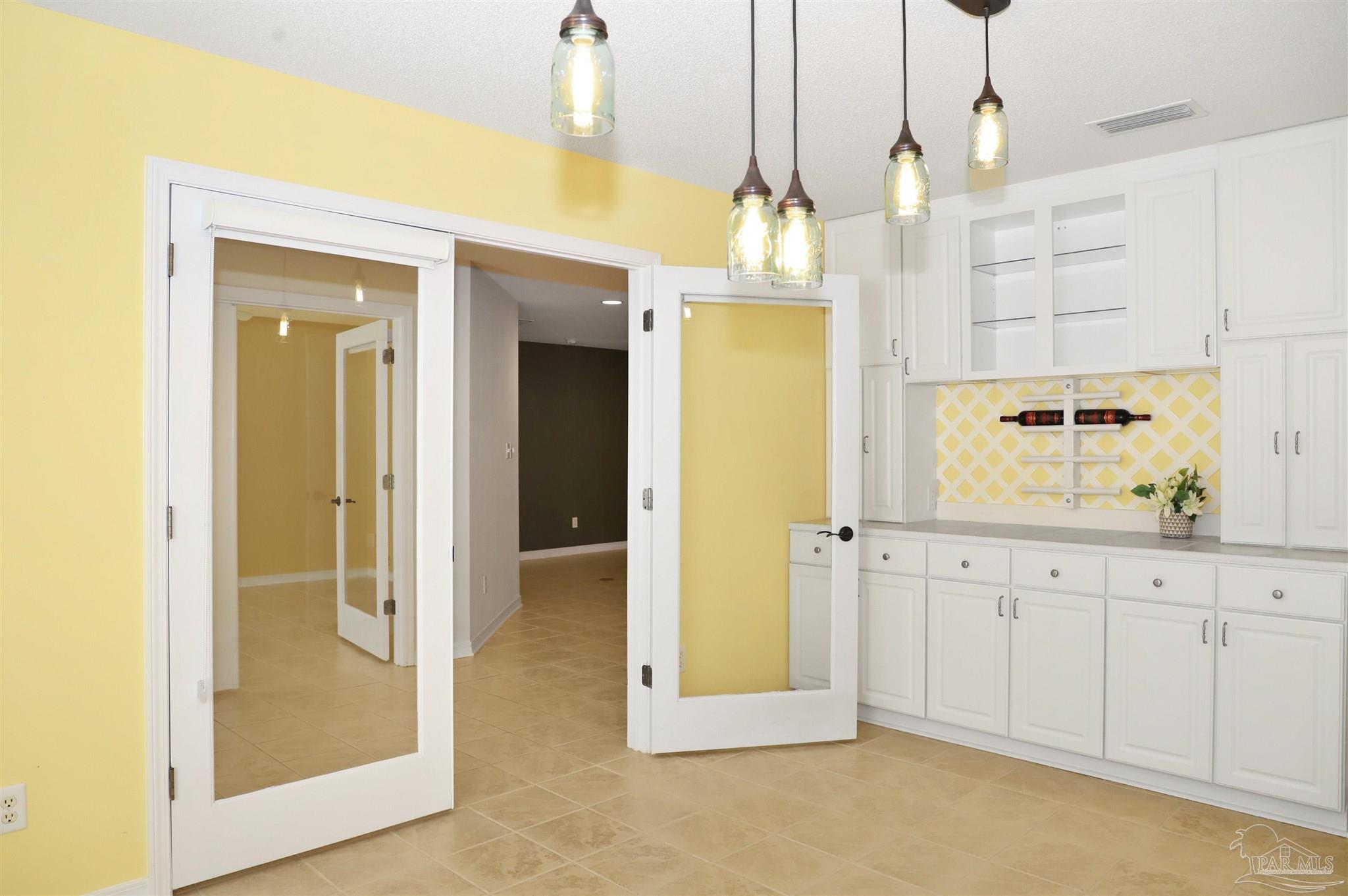 4454 Lyons Place Holt, FL 32564 - Photo 20 of 53 a view of a kitchen with wooden floor