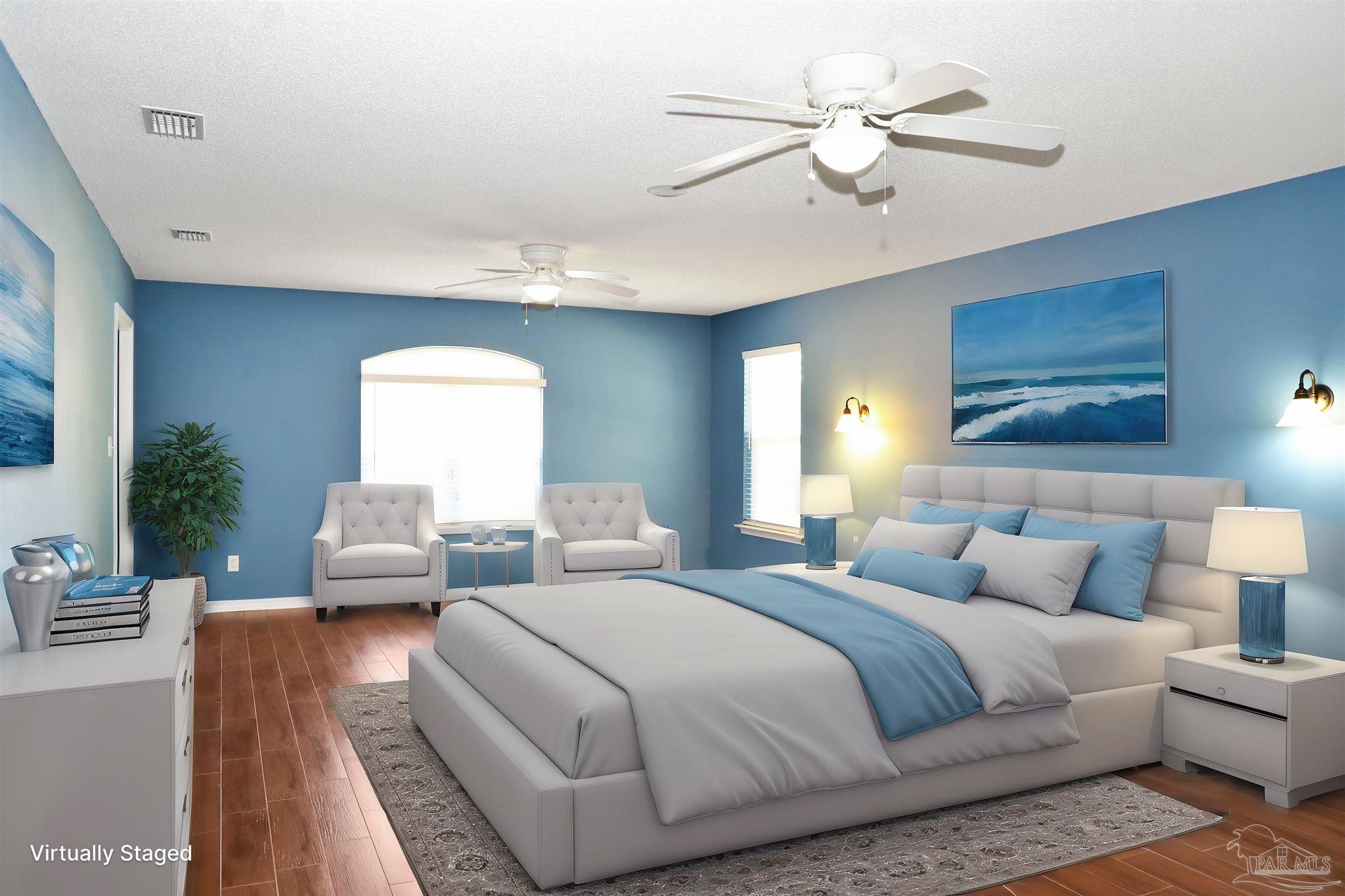 4454 Lyons Place Holt, FL 32564 - Photo 22 of 53 a bedroom with bed and a couch