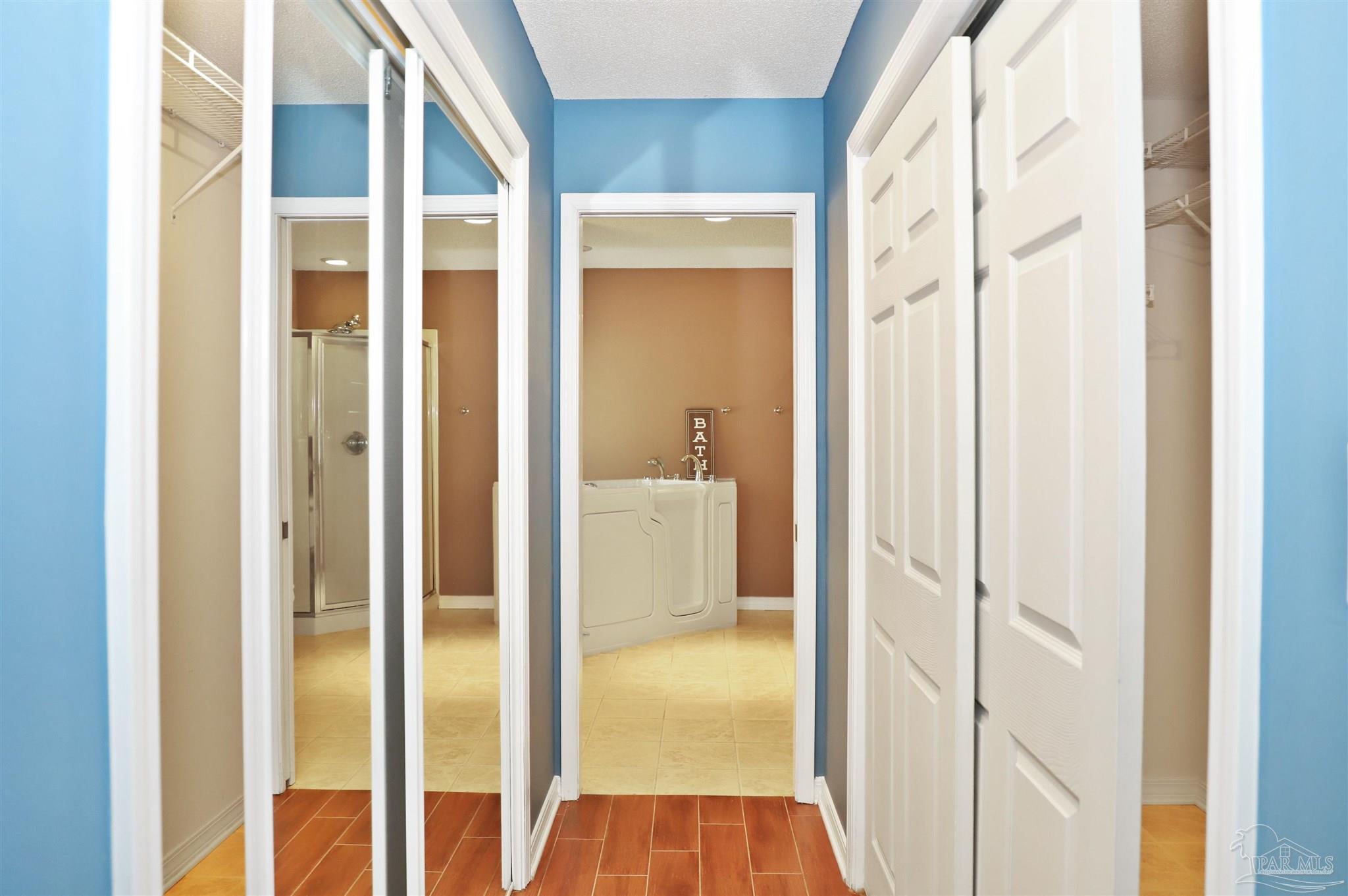 4454 Lyons Place Holt, FL 32564 - Photo 26 of 53 a view of a bathroom from a hallway