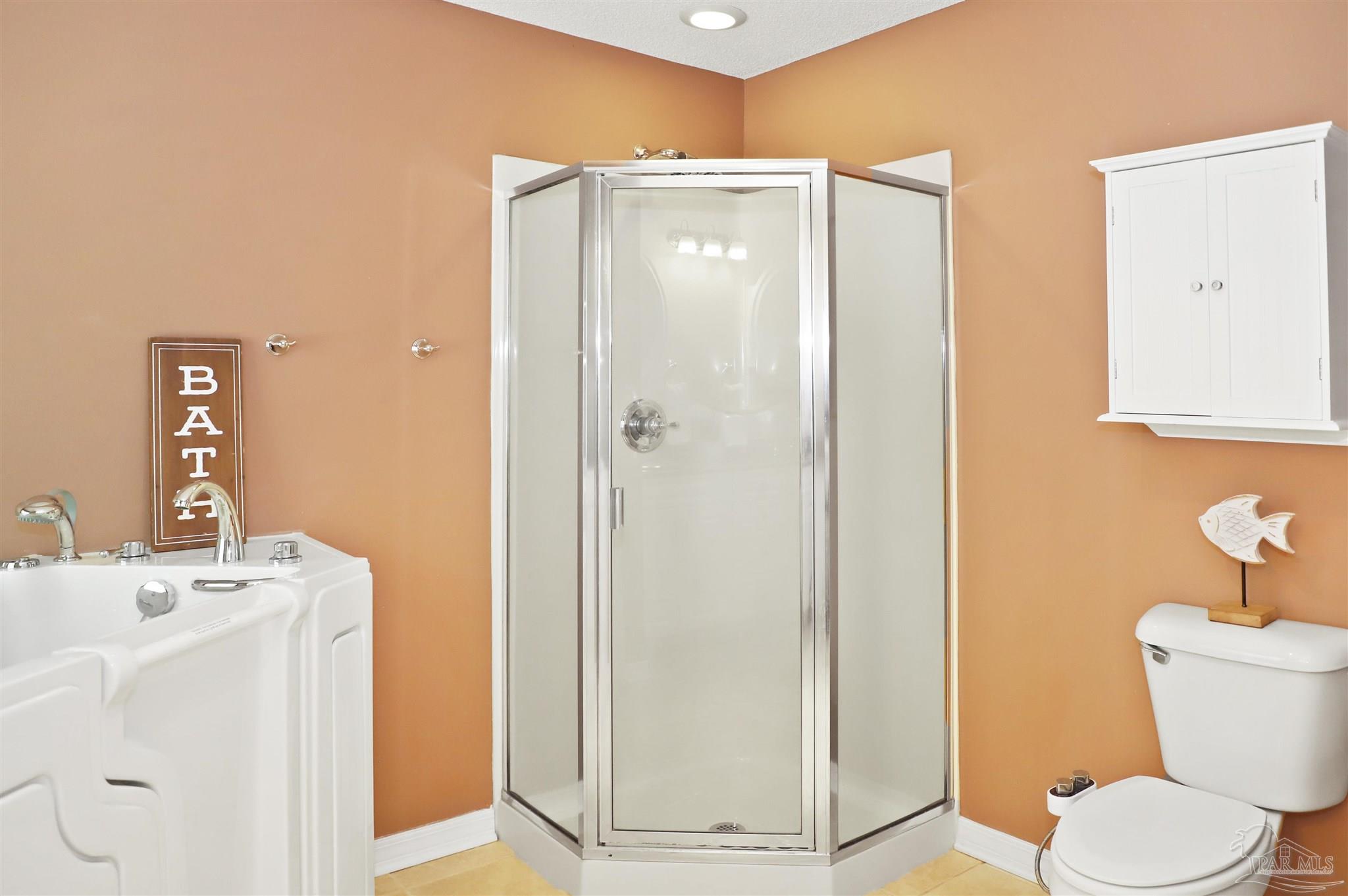 4454 Lyons Place Holt, FL 32564 - Photo 27 of 53 a bathroom with a sink a toilet and shower