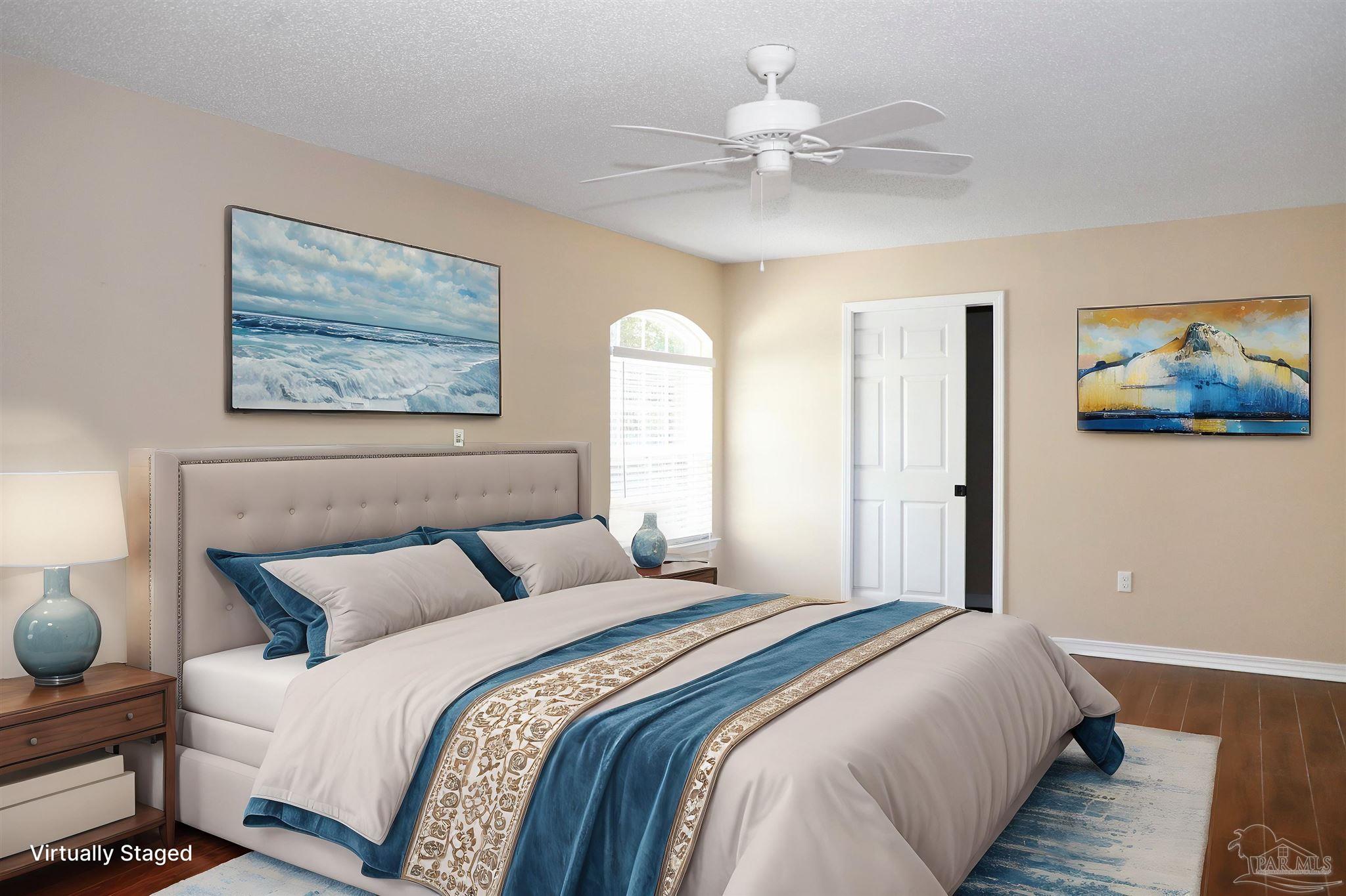 4454 Lyons Place Holt, FL 32564 - Photo 31 of 53 a bedroom with bed and a chandelier