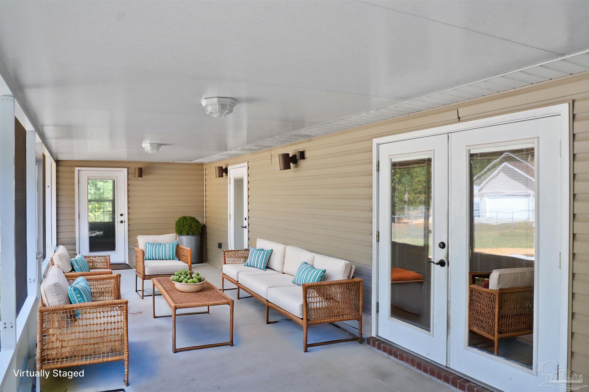 4454 Lyons Place Holt, FL 32564 - Photo 36 of 53 a living room with furniture and a window