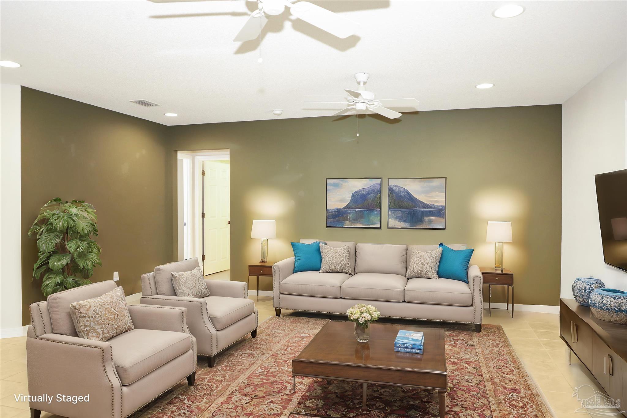 4454 Lyons Place Holt, FL 32564 - Photo 10 of 53 a living room with furniture and a flat screen tv