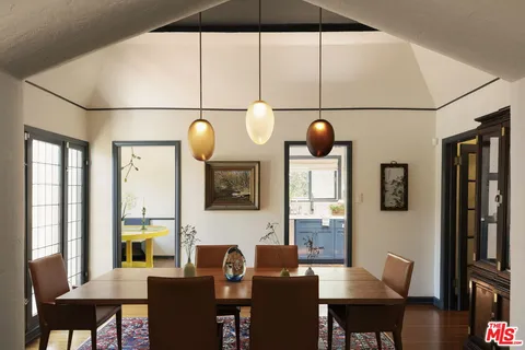 a view of dining room with furniture and window