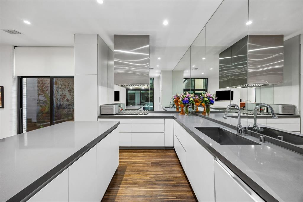 4321 Travis Street Dallas, TX 75205 - Photo 12 of 40 a large kitchen with stainless steel appliances lots of counter space and a sink
