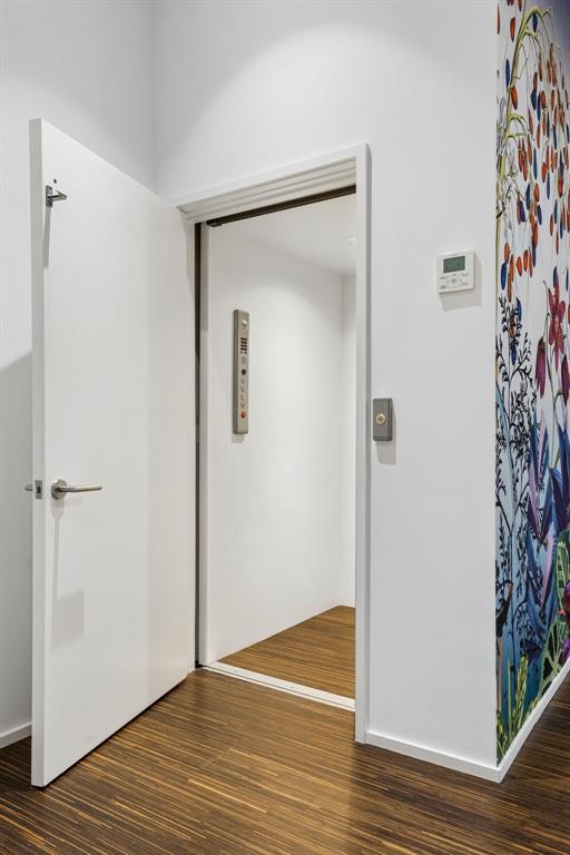 4321 Travis Street Dallas, TX 75205 - Photo 16 of 40 a view of an empty room with wooden floor and a bathroom