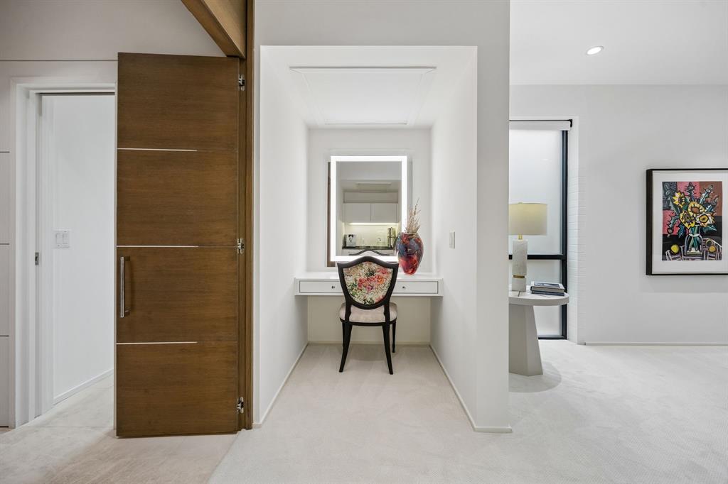 4321 Travis Street Dallas, TX 75205 - Photo 21 of 40 a view of a hallway with furniture and natural light