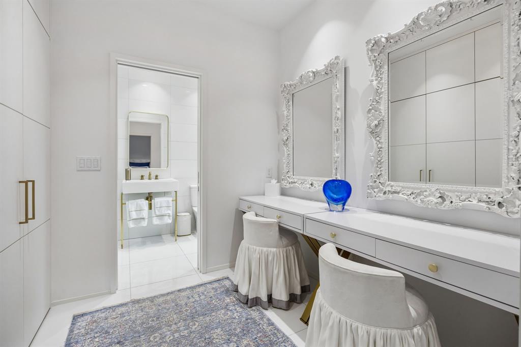 4321 Travis Street Dallas, TX 75205 - Photo 33 of 40 a bathroom with a sink and a mirror