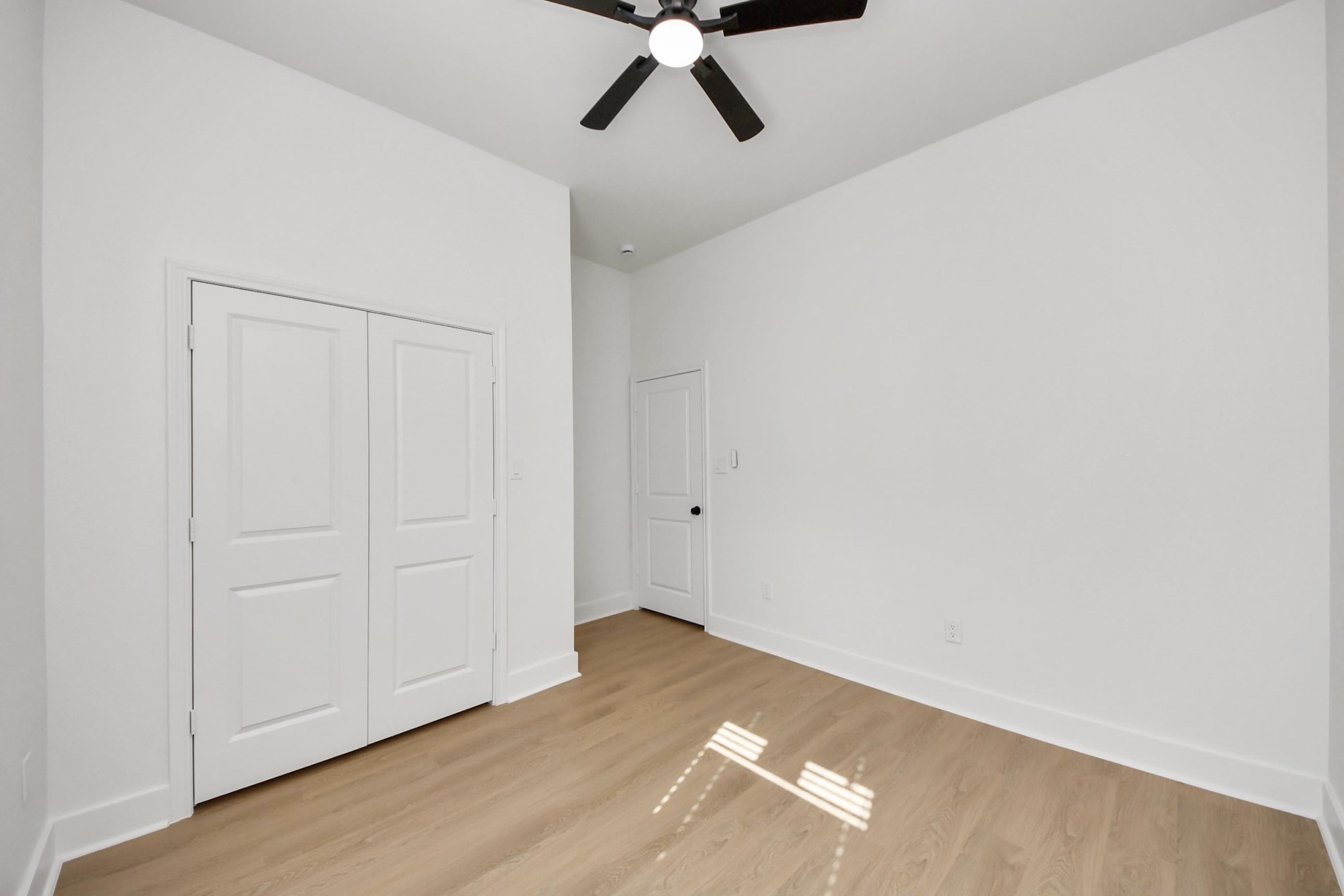 5226 Ricky Street Houston, TX 77033 - Photo 23 of 50 a view of empty room with wooden floor