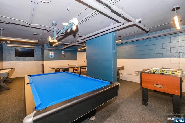 a view of a swimming pool with a table and chairs