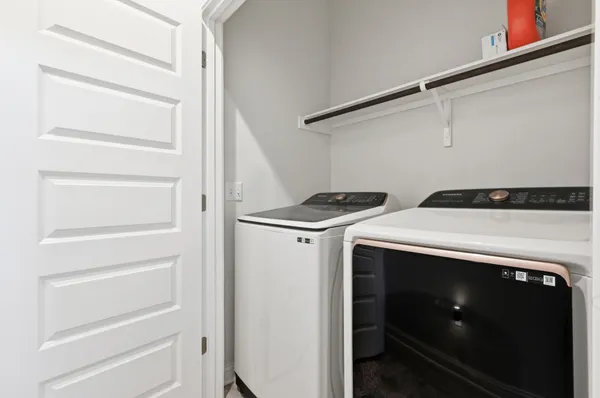 a utility room with washer and dryer