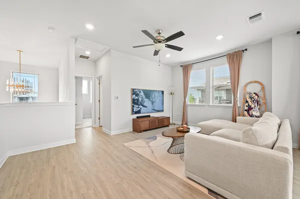 a living room with furniture and a large window