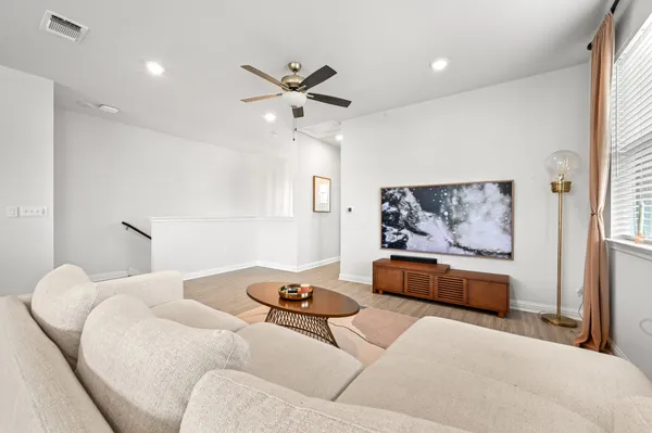 a living room with furniture and window
