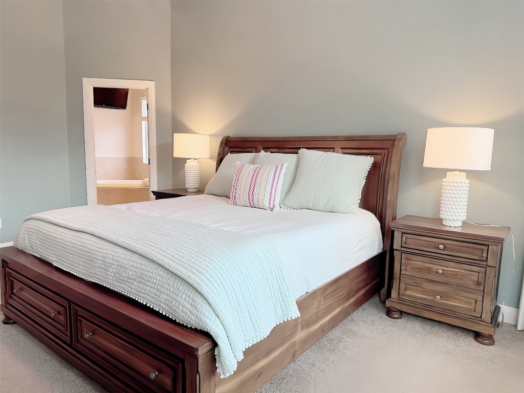 8709 Fescue Lane Austin, TX 78738 - Photo 12 of 36 a bedroom with a bed and a window