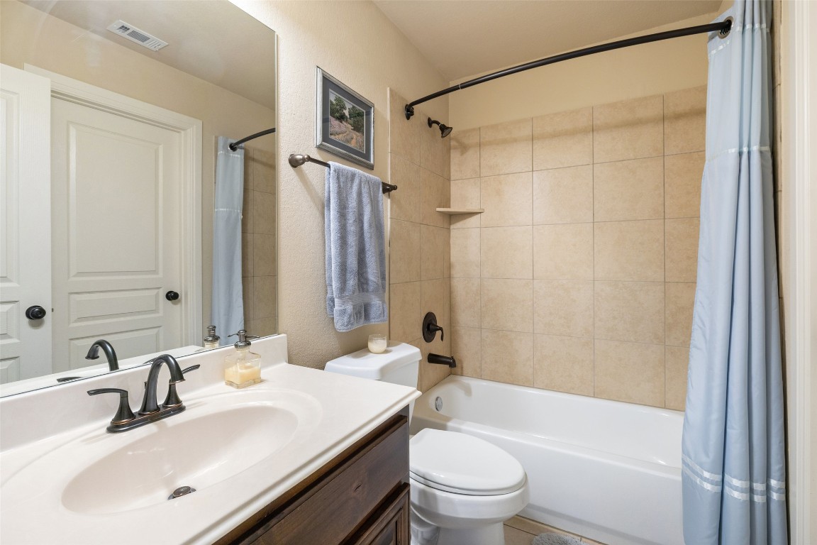 8709 Fescue Lane Austin, TX 78738 - Photo 24 of 36 a bathroom with a sink toilet and shower