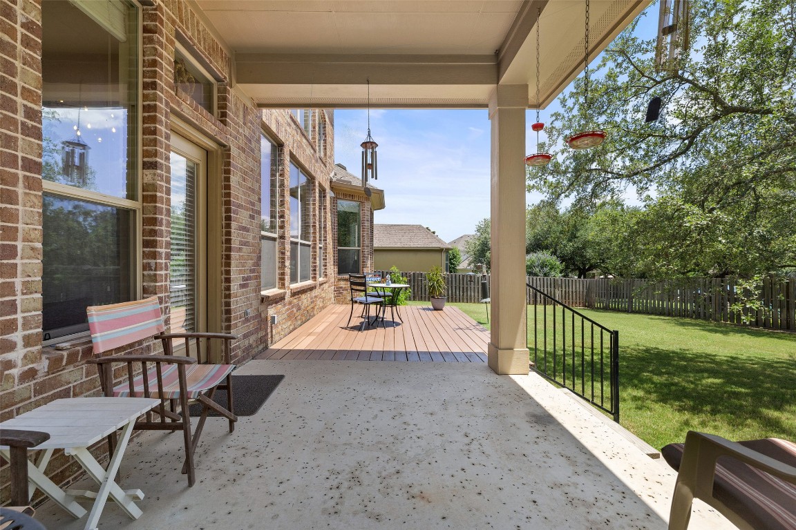 8709 Fescue Lane Austin, TX 78738 - Photo 26 of 36 a view of a patio with a table and chairs