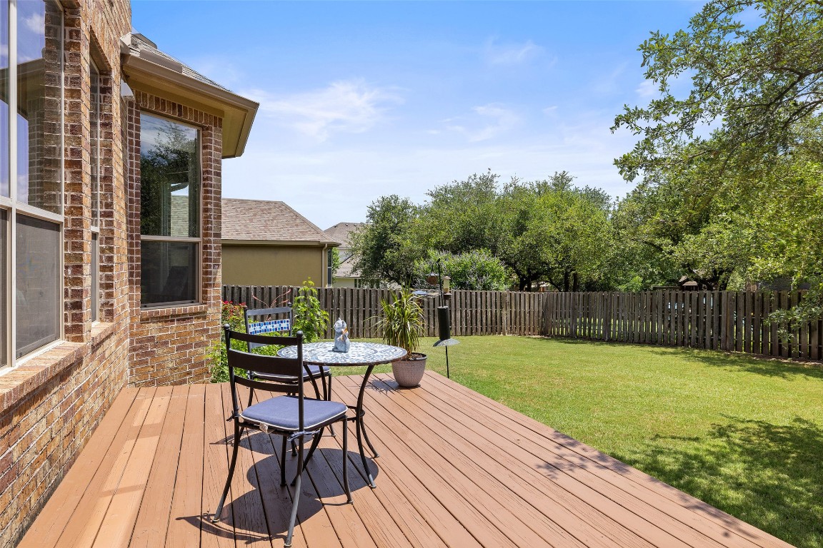 8709 Fescue Lane Austin, TX 78738 - Photo 27 of 36 a view of a chairs and table on the wooden deck
