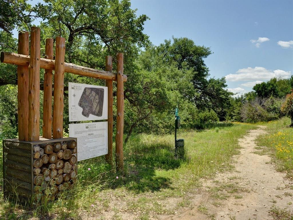 8709 Fescue Lane Austin, TX 78738 - Photo 32 of 36 Rocky Creek offers trails for hiking and biking with a creek and a pond