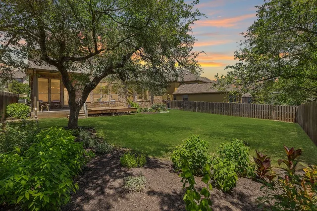 a living room with furniture a fireplace and a table