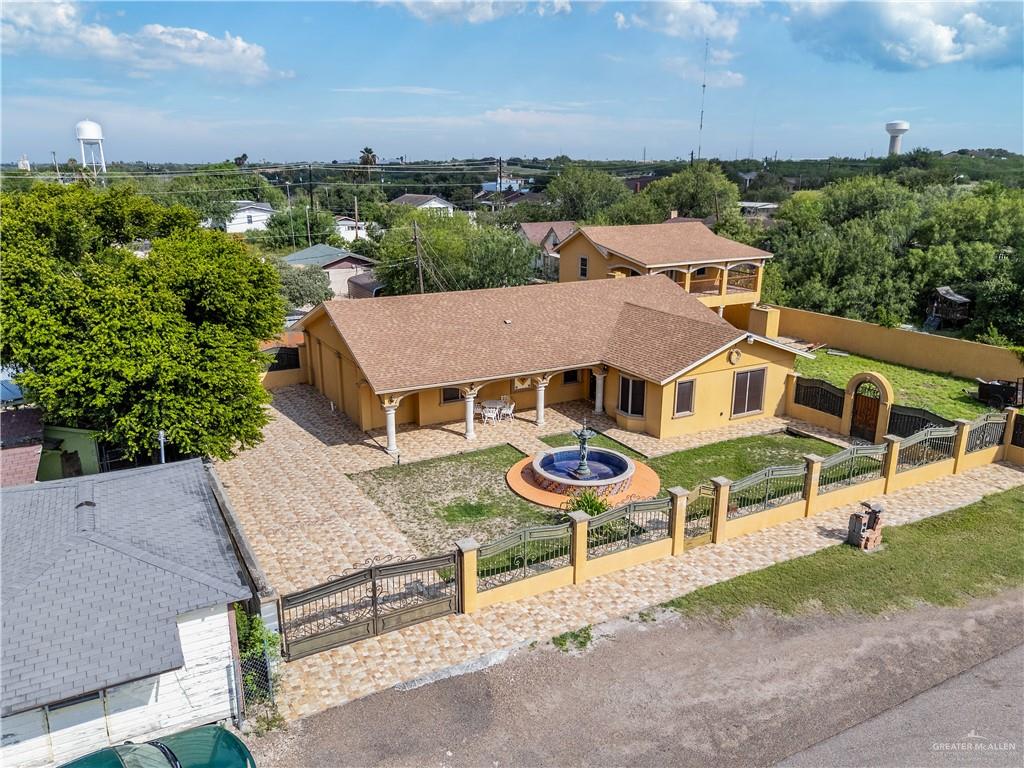 610 North Texas Street Rio Grande City, TX 78582 - Photo 19 of 23 an aerial view of a house with garden space and street view
