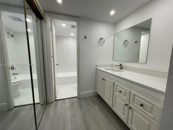 a bathroom with 2 sink and a mirror