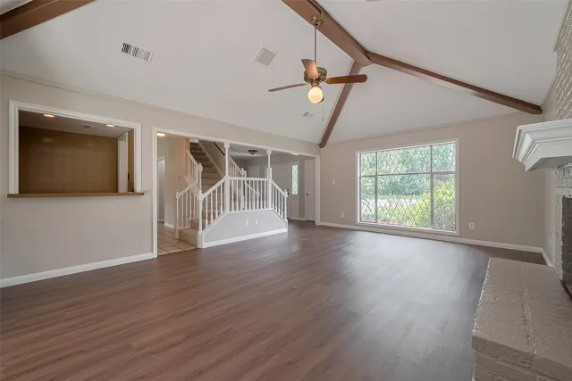 a kitchen with cabinets and window