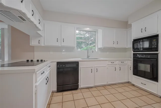 a view of room with window and ceiling fan