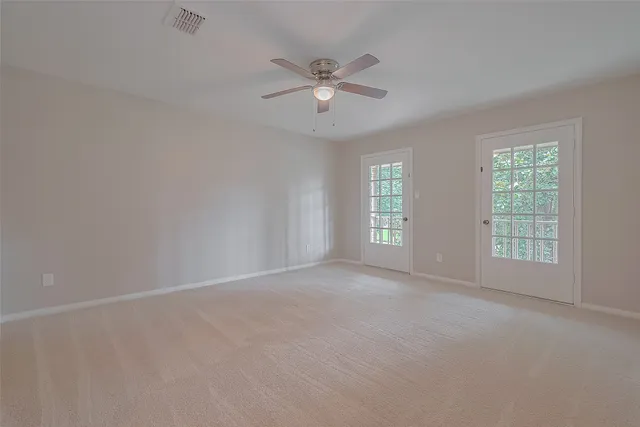 an aerial view of a house with a yard and garden