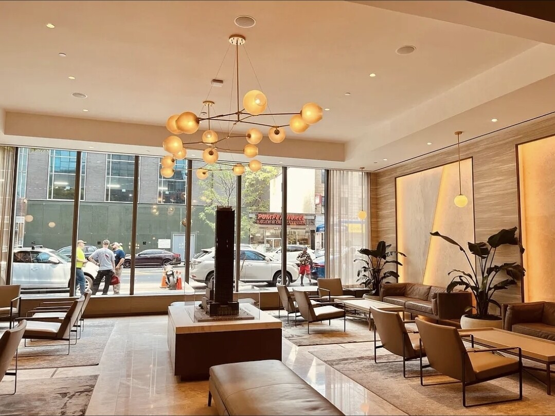 3 Court Square, Unit 2904 Queens, NY 11101 - Photo 10 of 12 a view of a living room with furniture and floor to ceiling windows