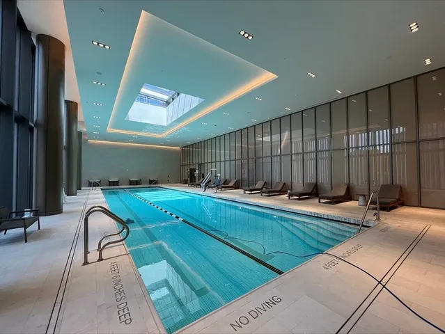 a living room with a couch and a rug