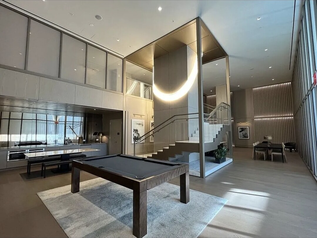 3 Court Square, Unit 2904 Queens, NY 11101 - Photo 9 of 12 a lobby with furniture and a potted plant