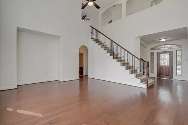 a view of an entryway with wooden floor