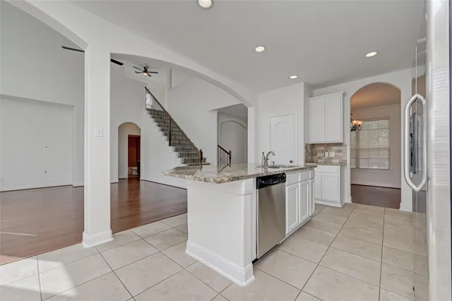 a kitchen with a sink and refrigerator