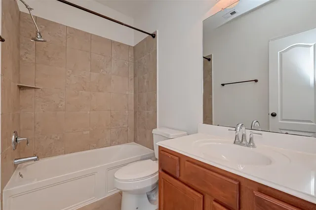 a bathroom with a sink a toilet and a bathtub