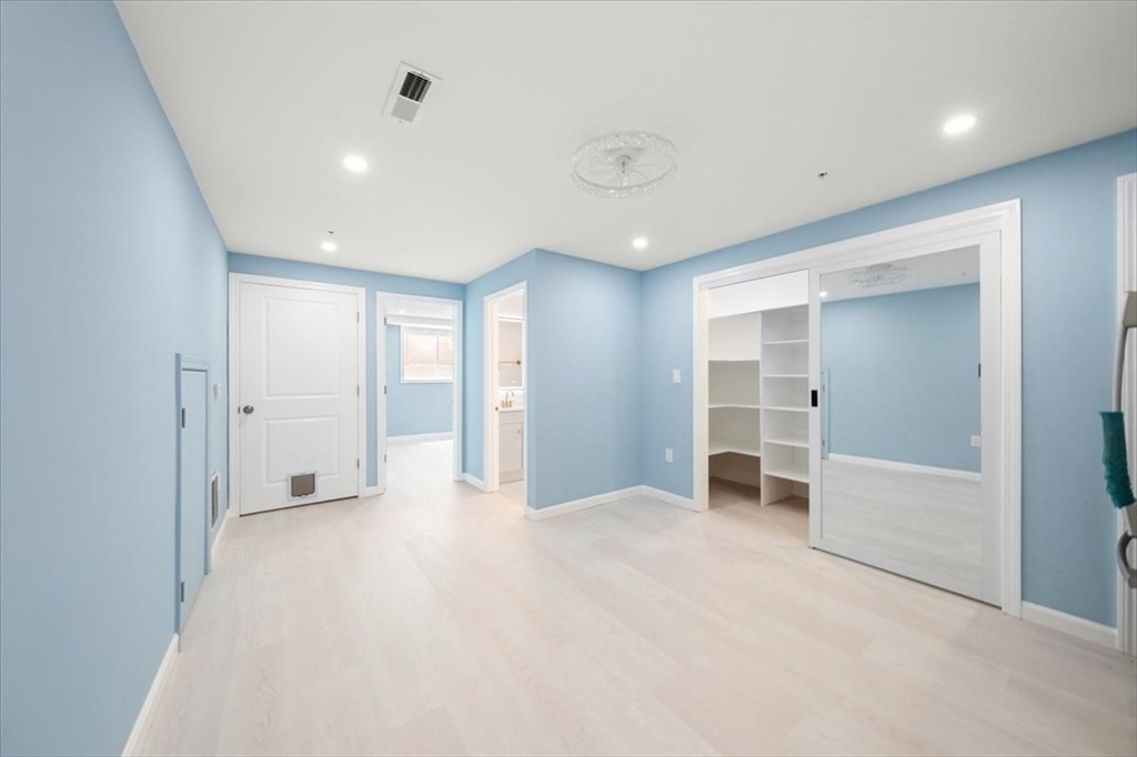 6 Bates Street, Unit A Devens, MA 01434 - Photo 30 of 41 an empty room with closet and windows