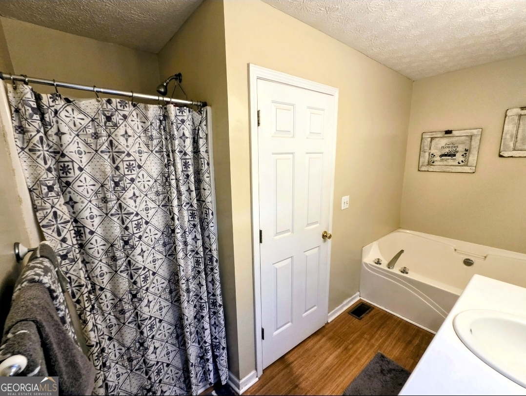21 Baskin Heights Path Temple, GA 30179 - Photo 21 of 44 a bathroom with a bathtub and shower