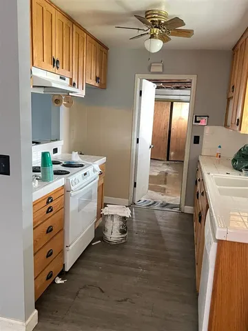 a kitchen that has a lot of cabinets in it