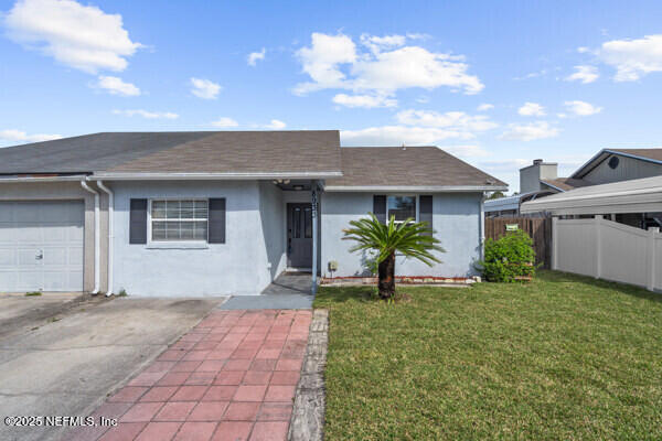 8933 Ivey Road Jacksonville, FL 32216 - Photo 2 of 24 Front.
