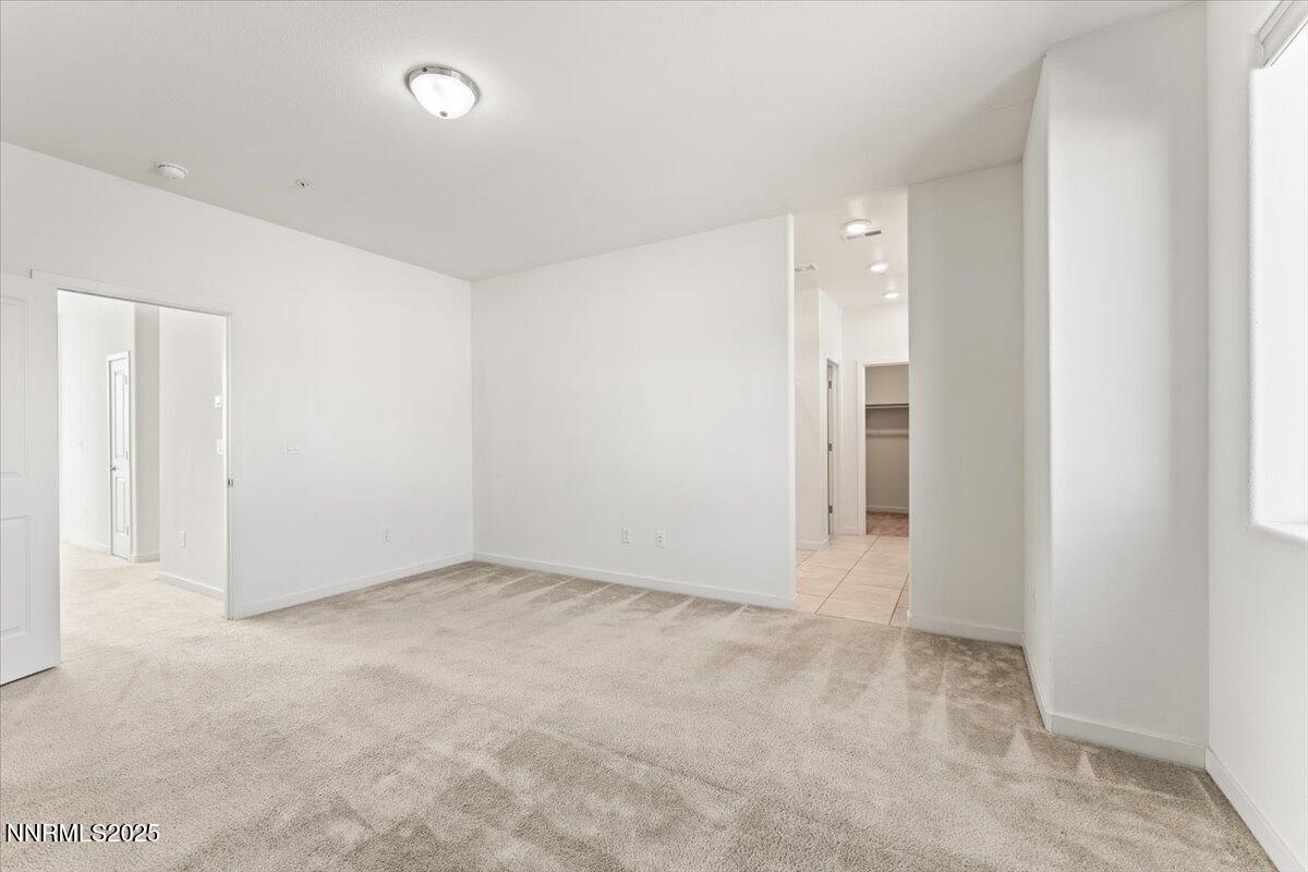 1048 Big Rock Loop Sun Valley, NV 89433 - Photo 14 of 25 an empty room with an entryway