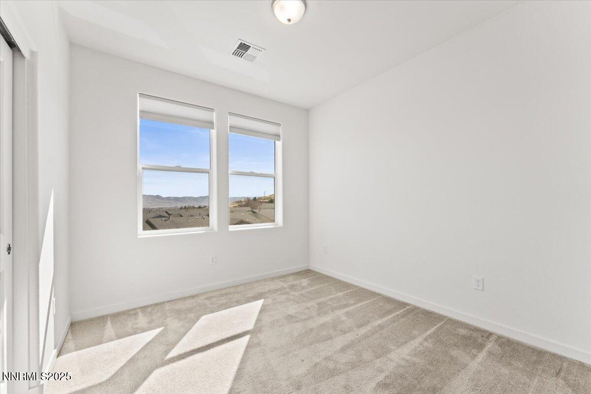 1048 Big Rock Loop Sun Valley, NV 89433 - Photo 16 of 25 a view of an empty room with a window