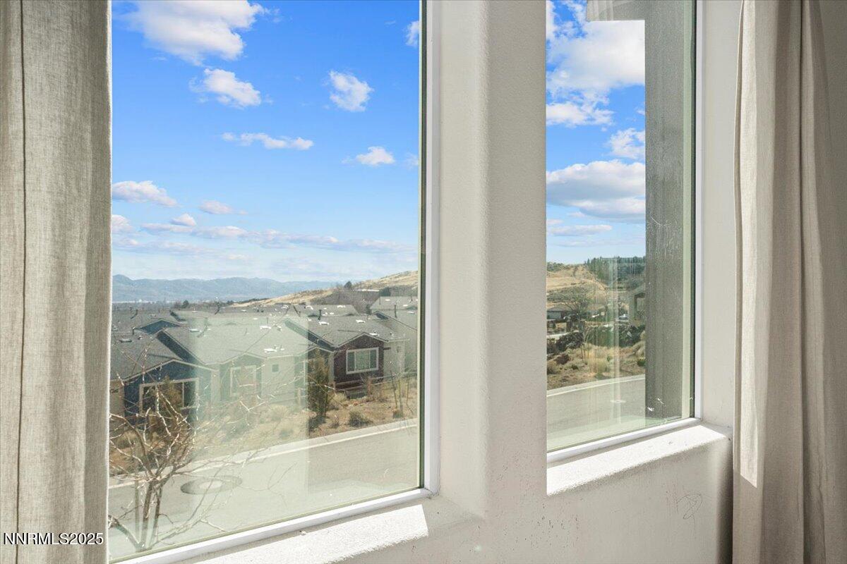 1048 Big Rock Loop Sun Valley, NV 89433 - Photo 23 of 25 a view of a glass door of the house
