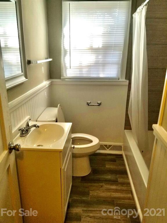 1135 Skyview Road Charlotte, NC 28208 - Photo 12 of 14 a bathroom with a sink and a toilet