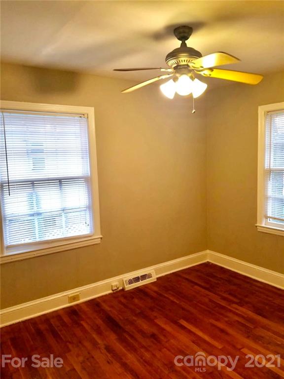 1135 Skyview Road Charlotte, NC 28208 - Photo 6 of 14 a view of a small space with wooden floor and a window