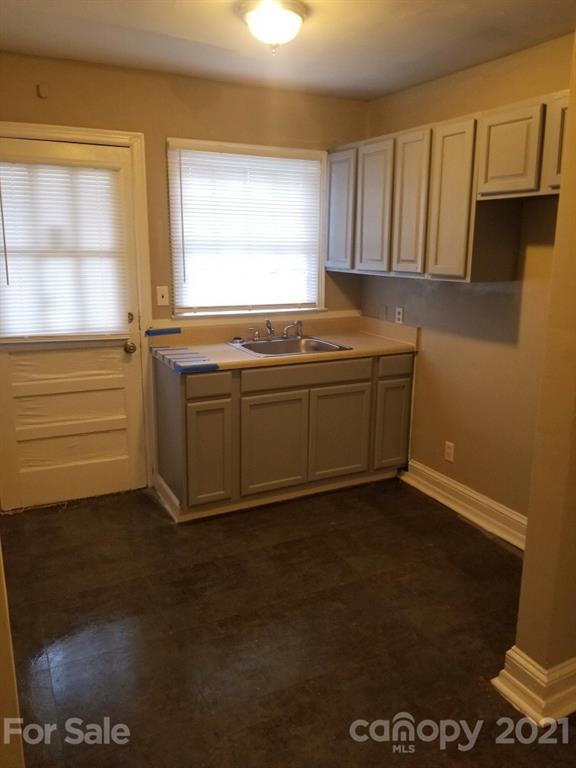 1135 Skyview Road Charlotte, NC 28208 - Photo 7 of 14 a view of kitchen with granite countertop cabinets appliances and a window