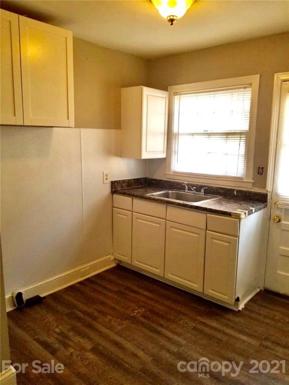 1135 Skyview Road Charlotte, NC 28208 - Photo 8 of 14 a view of a kitchen with wooden floor