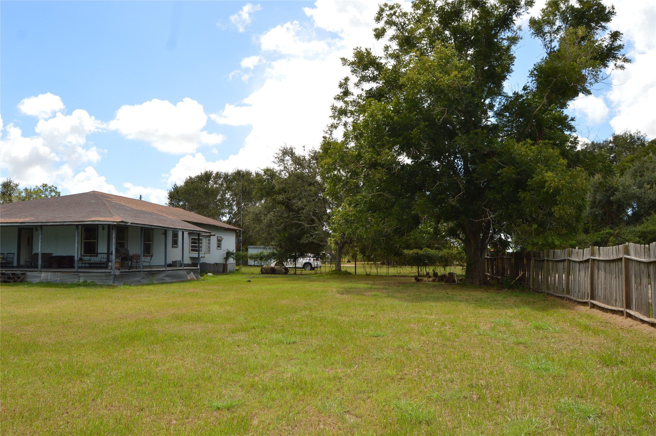 692 Cashscreek Road Palacios, TX 77465 - Photo 21 of 31 a view of a house with swimming pool and a yard