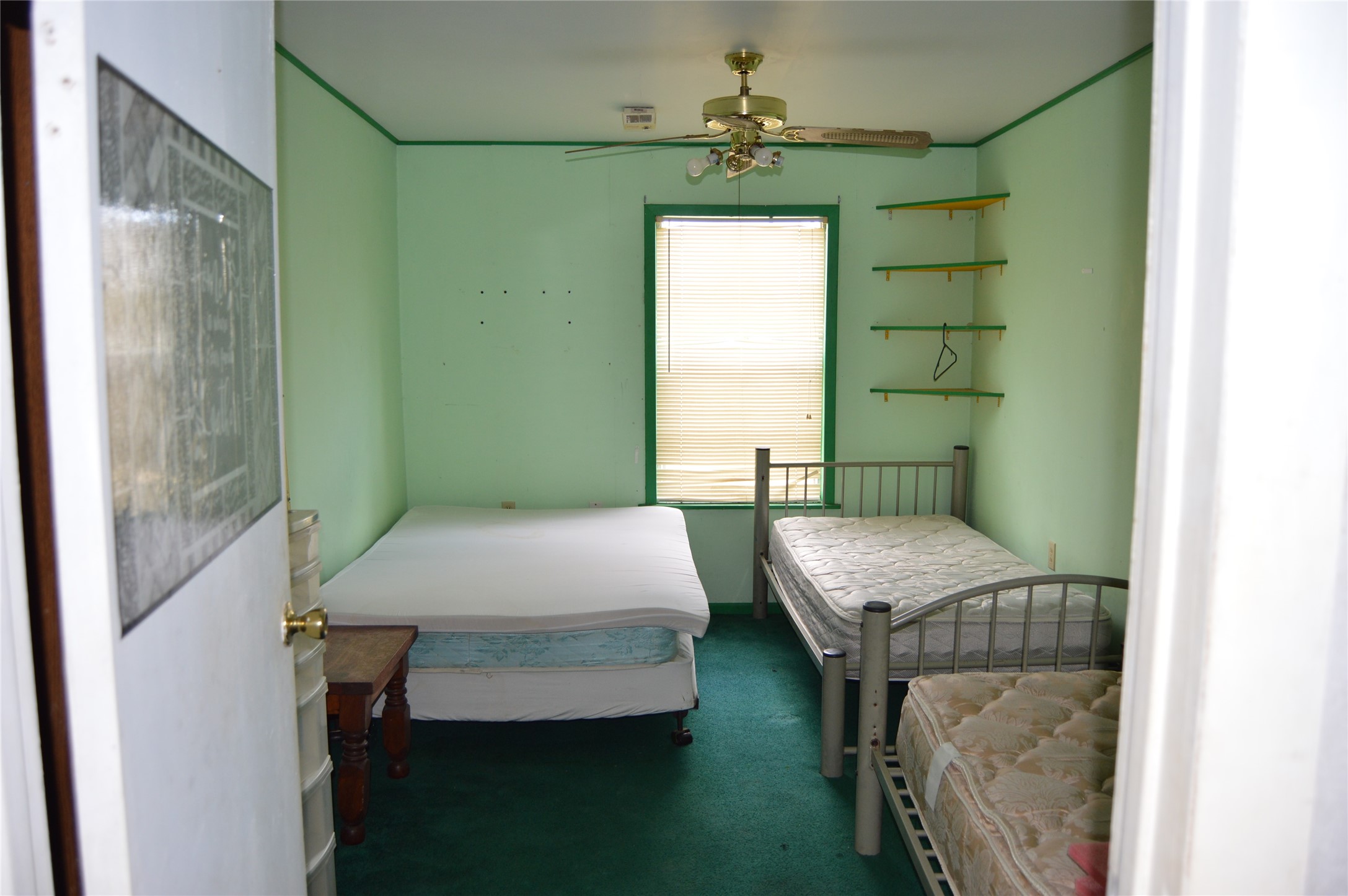 692 Cashscreek Road Palacios, TX 77465 - Photo 8 of 31 a bedroom with a bed and a chandelier