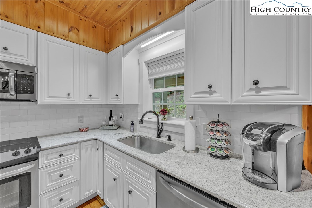 201 Eagles Nest Trail West Jefferson, NC 28694 - Photo 11 of 43 a kitchen with sink cabinets and stove