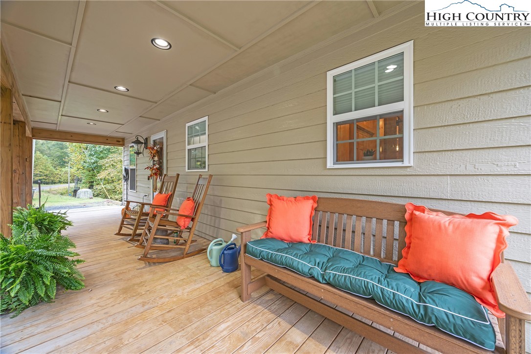 201 Eagles Nest Trail West Jefferson, NC 28694 - Photo 5 of 43 an outdoor sitting area with couch and wooden floor